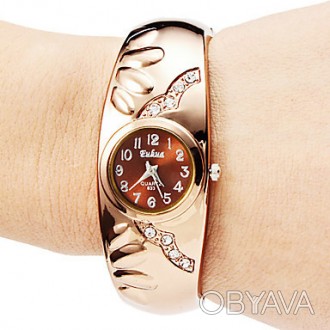 Классические женские часы на жестком бандажном ремешке , выполнены из нержавеюще. . фото 1
